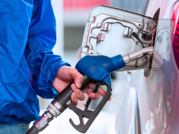 Person refuelling Car